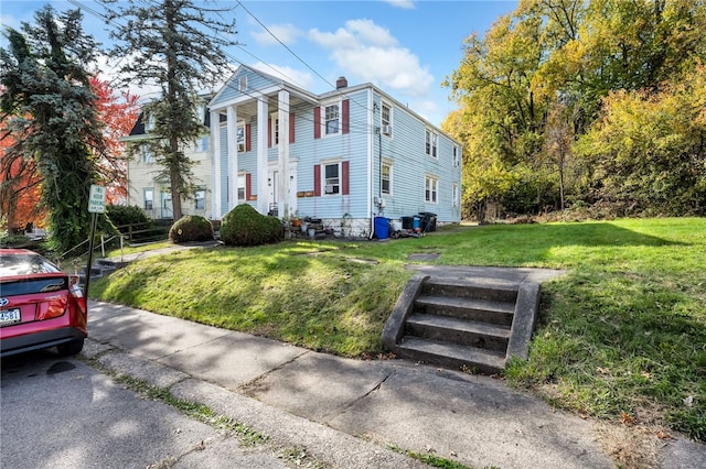 view of front of house with a front lawn