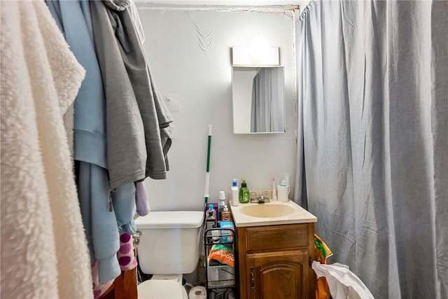 bathroom with vanity and toilet