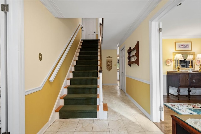 staircase with crown molding