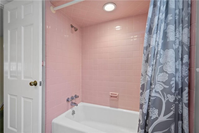 bathroom featuring shower / bath combination with curtain