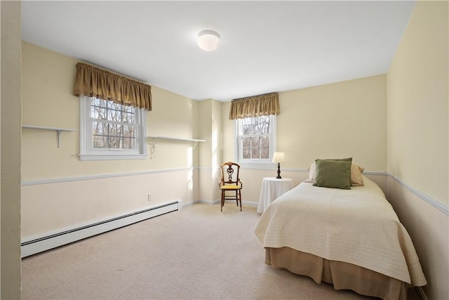 bedroom with carpet floors and a baseboard radiator