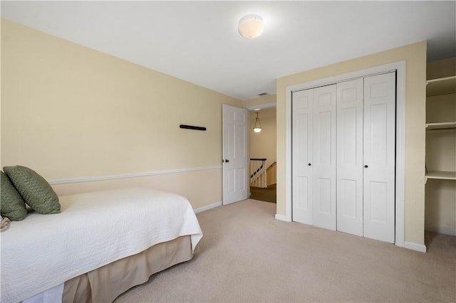 carpeted bedroom with a closet