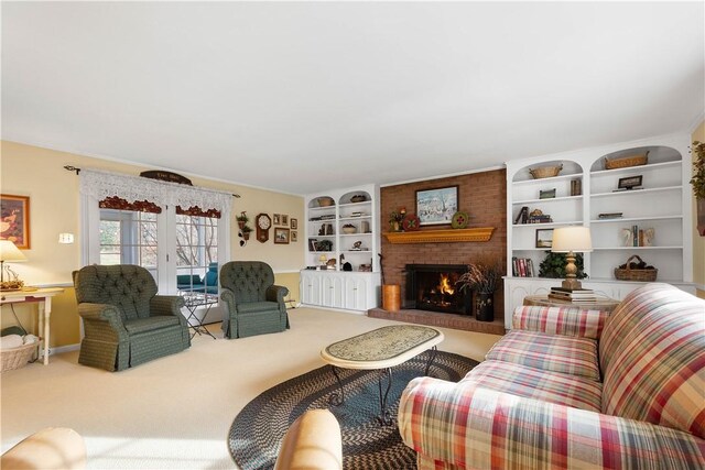 carpeted living room with a fireplace and french doors