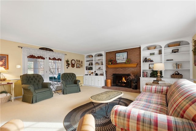 carpeted living room featuring built in shelves, a fireplace, and french doors