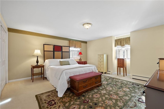 bedroom featuring multiple windows, light carpet, and a baseboard heating unit