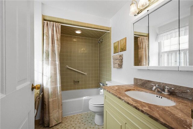 full bathroom featuring vanity, toilet, and shower / bath combo with shower curtain