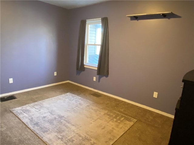 empty room with carpet flooring