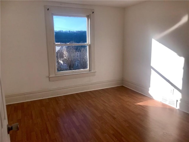 spare room featuring hardwood / wood-style floors