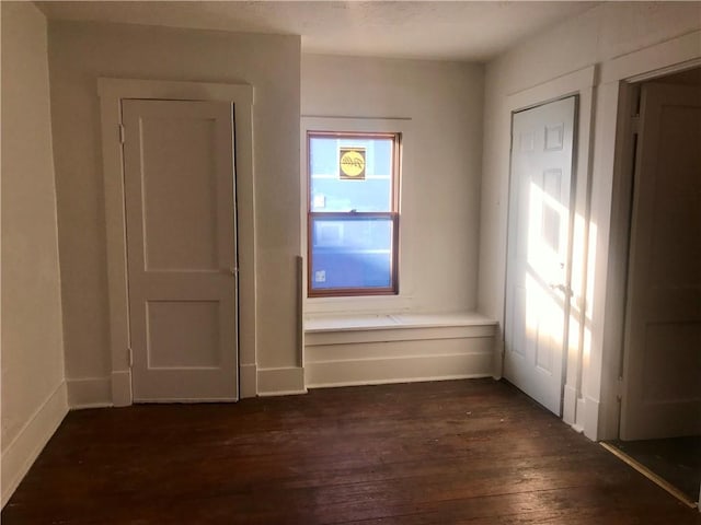 empty room featuring dark hardwood / wood-style floors