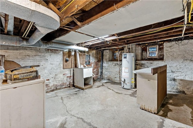unfinished below grade area featuring water heater