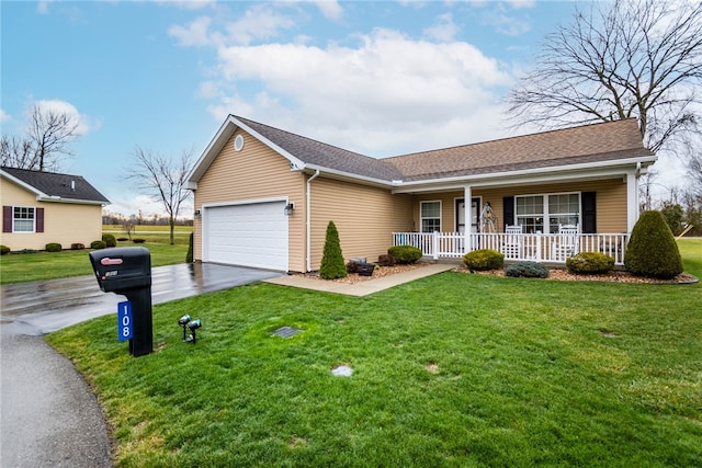 ranch-style house featuring a front yard, a porch, and a garage