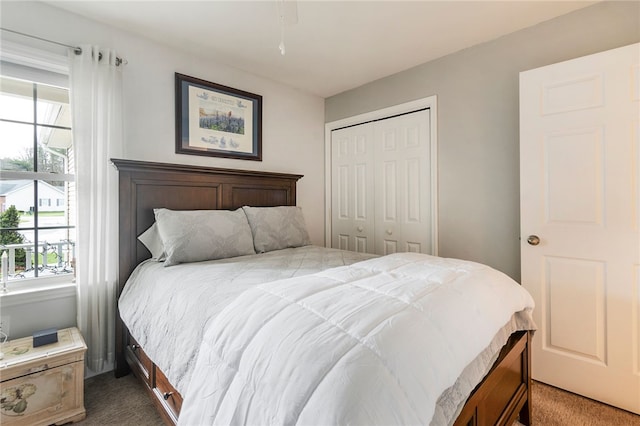 carpeted bedroom with a closet