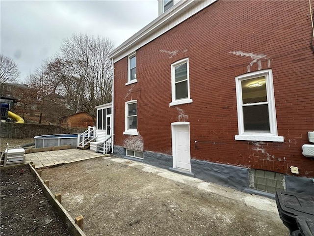 view of side of home featuring a patio