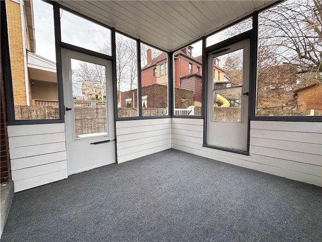 unfurnished sunroom featuring plenty of natural light