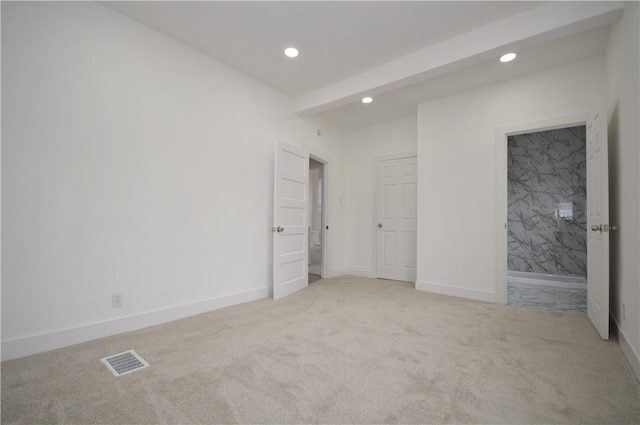 unfurnished bedroom featuring light colored carpet