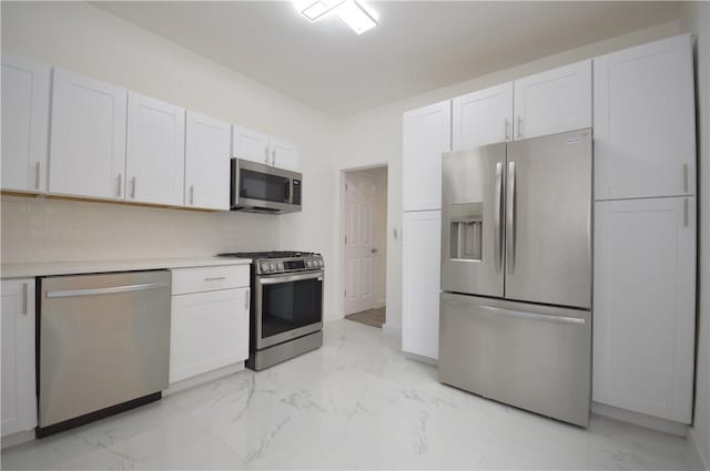 kitchen with white cabinetry and stainless steel appliances