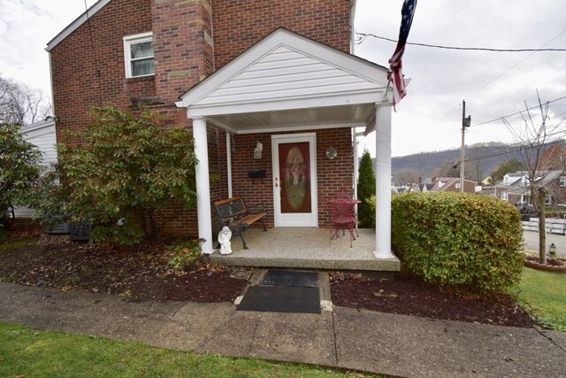 property entrance with covered porch