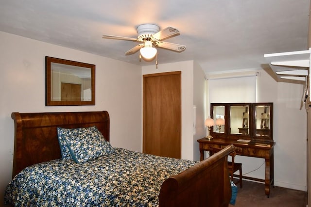 bedroom with carpet, a closet, and ceiling fan