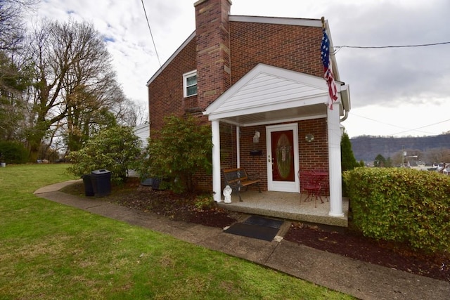 rear view of house with a yard