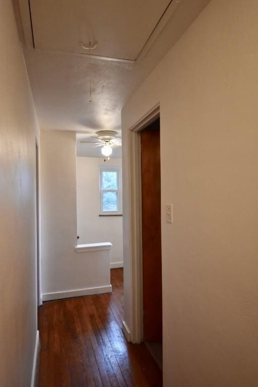 hall with dark hardwood / wood-style flooring