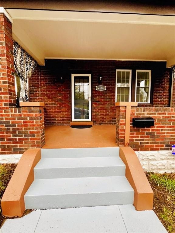 property entrance featuring covered porch