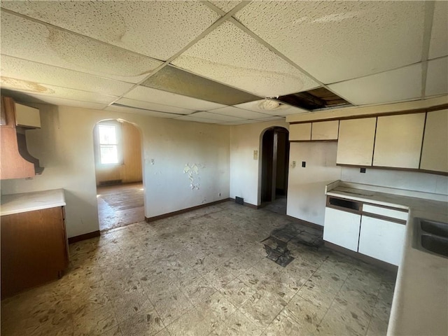 kitchen with a drop ceiling and sink