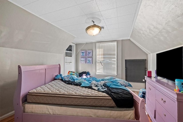 bedroom with lofted ceiling