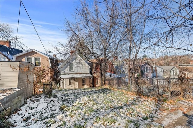 view of yard layered in snow