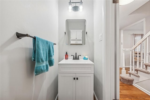 bathroom featuring vanity and wood-type flooring