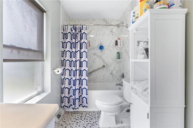 full bathroom featuring vanity, shower / bath combo, and toilet