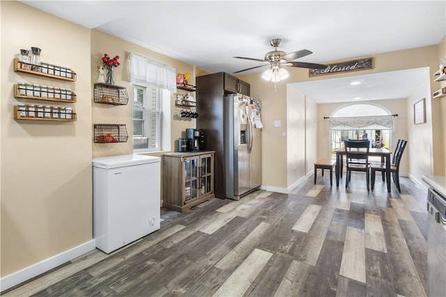 kitchen with stainless steel fridge, dark brown cabinets, refrigerator, and dark hardwood / wood-style floors