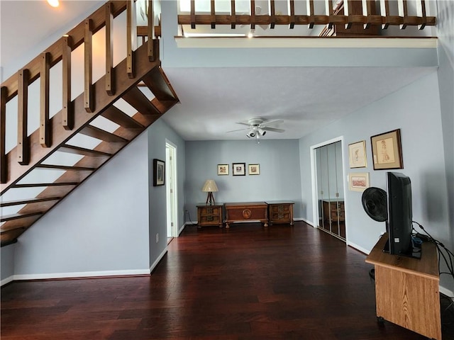 interior space featuring ceiling fan and dark hardwood / wood-style flooring