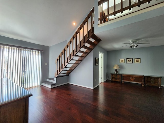 interior space featuring dark wood-type flooring and ceiling fan