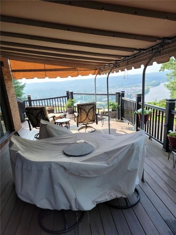 wooden terrace with a water view