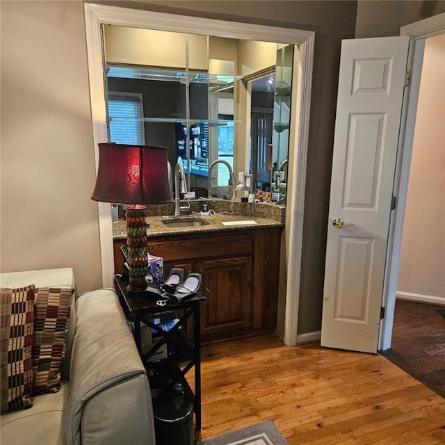 bathroom featuring vanity and hardwood / wood-style floors