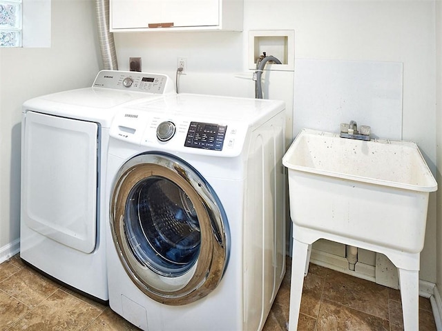 laundry room featuring separate washer and dryer and sink