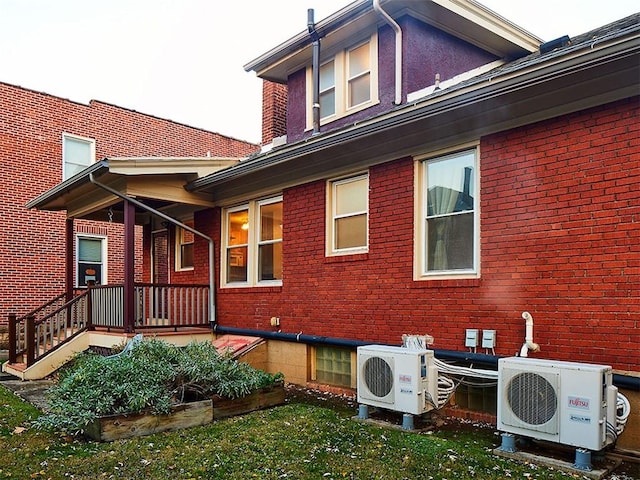 back of house with ac unit