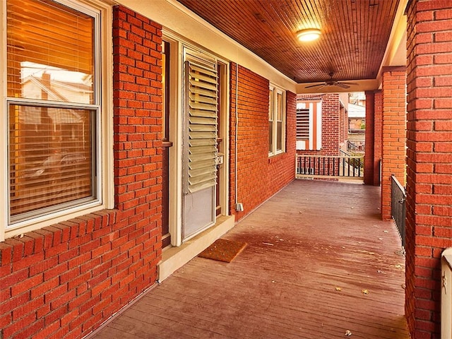 exterior space with ceiling fan and a porch