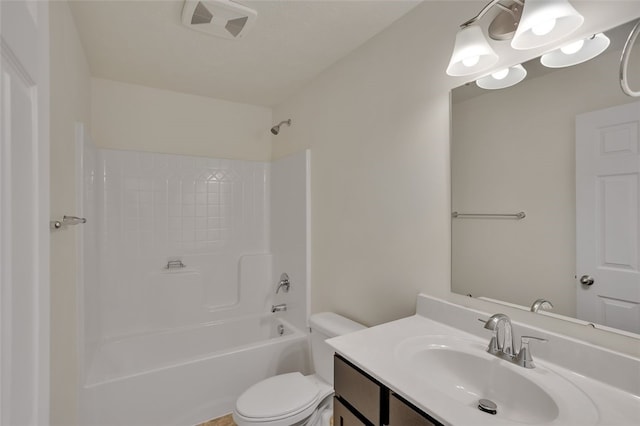 full bathroom featuring washtub / shower combination, vanity, and toilet