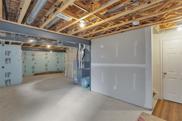 basement featuring heating unit