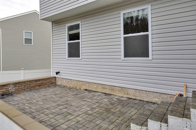 view of property exterior featuring a patio area