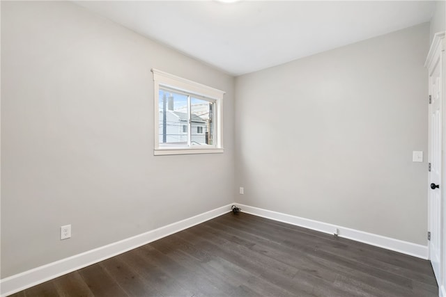 empty room featuring dark wood-type flooring