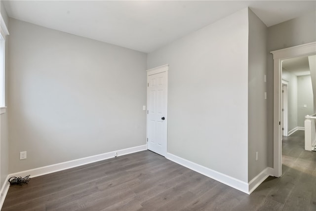 unfurnished room featuring dark hardwood / wood-style floors