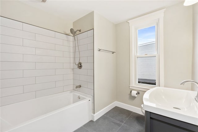 bathroom featuring tile patterned floors, vanity, and tiled shower / bath