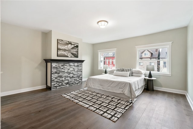 bedroom with dark wood-type flooring