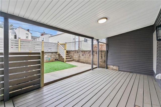 wooden terrace with a patio