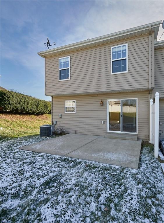 rear view of house featuring a patio area and central air condition unit