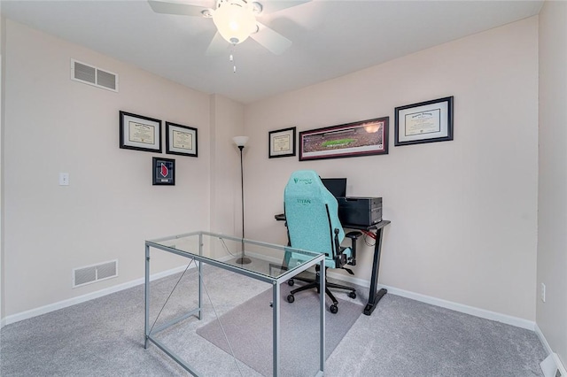 office with carpet flooring and ceiling fan