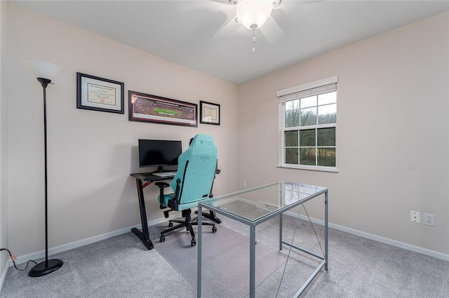 carpeted home office with ceiling fan