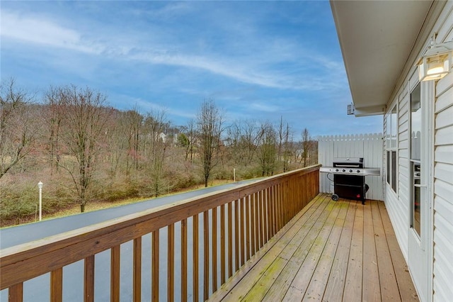 wooden terrace featuring a grill